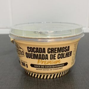 Embalagem de cocada cremosa de coco queimado, destacando informações nutricionais e instruções de consumo.