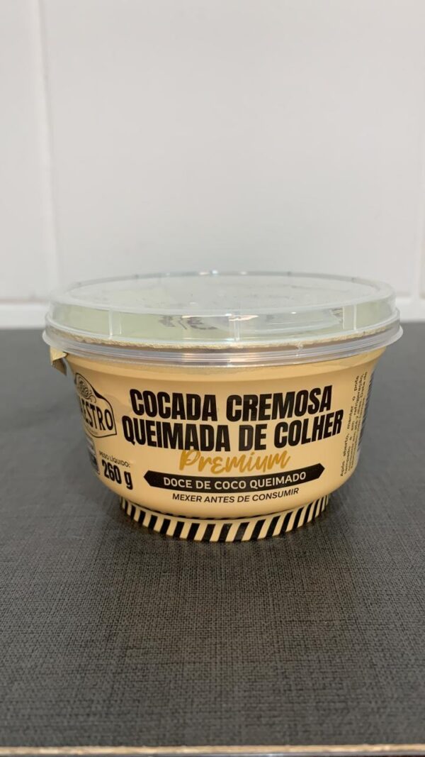 Embalagem de cocada cremosa de coco queimado, destacando informações nutricionais e instruções de consumo.