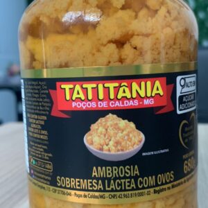 Frasco de 680g contendo ambrosia láctea com ovos da marca Tatitânia, com rótulo informativo sobre o produto.